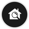 House with a magnifying glass over it icon